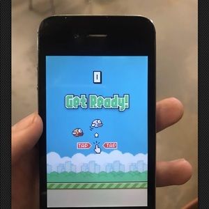 iPhone 4s with flappy bird app